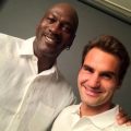 Michael Jordan cheers as Federer wins first round in US Open