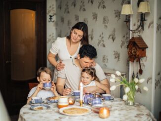 A Happy Family Drinking Tea at Home