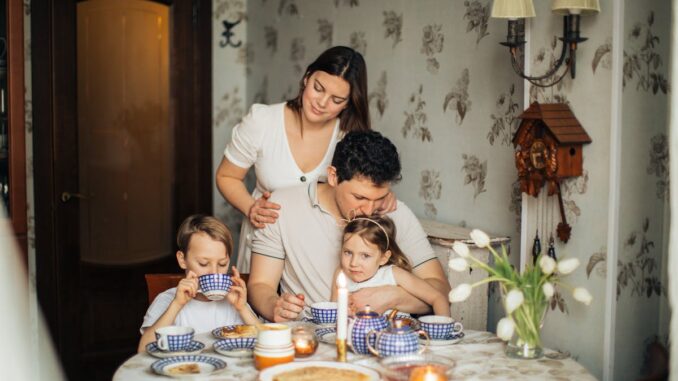 A Happy Family Drinking Tea at Home