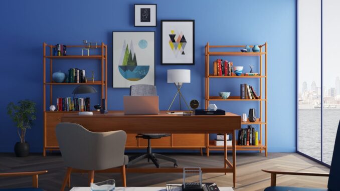 Brown Wooden Desk With Rolling Chair and Shelves Near Window