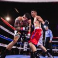 Low-Angle Photo of Two Men Fighting in Boxing Ring