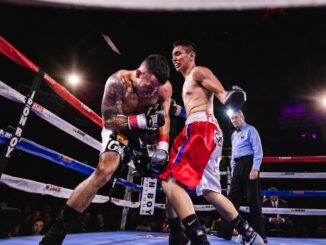 Low-Angle Photo of Two Men Fighting in Boxing Ring