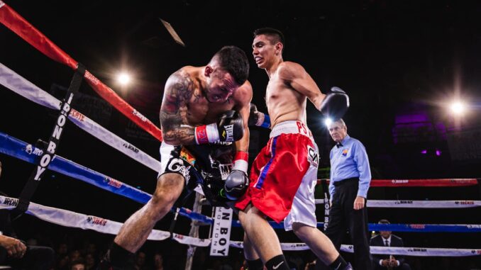 Low-Angle Photo of Two Men Fighting in Boxing Ring