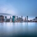 Body of Water Near City Buildings