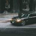 Black Bmw Sedan Beside Concrete Curb