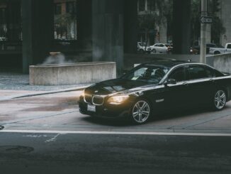 Black Bmw Sedan Beside Concrete Curb