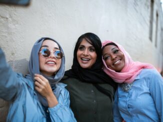 Women Wearing Headscarves Taking a Selfie