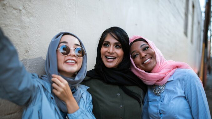 Women Wearing Headscarves Taking a Selfie