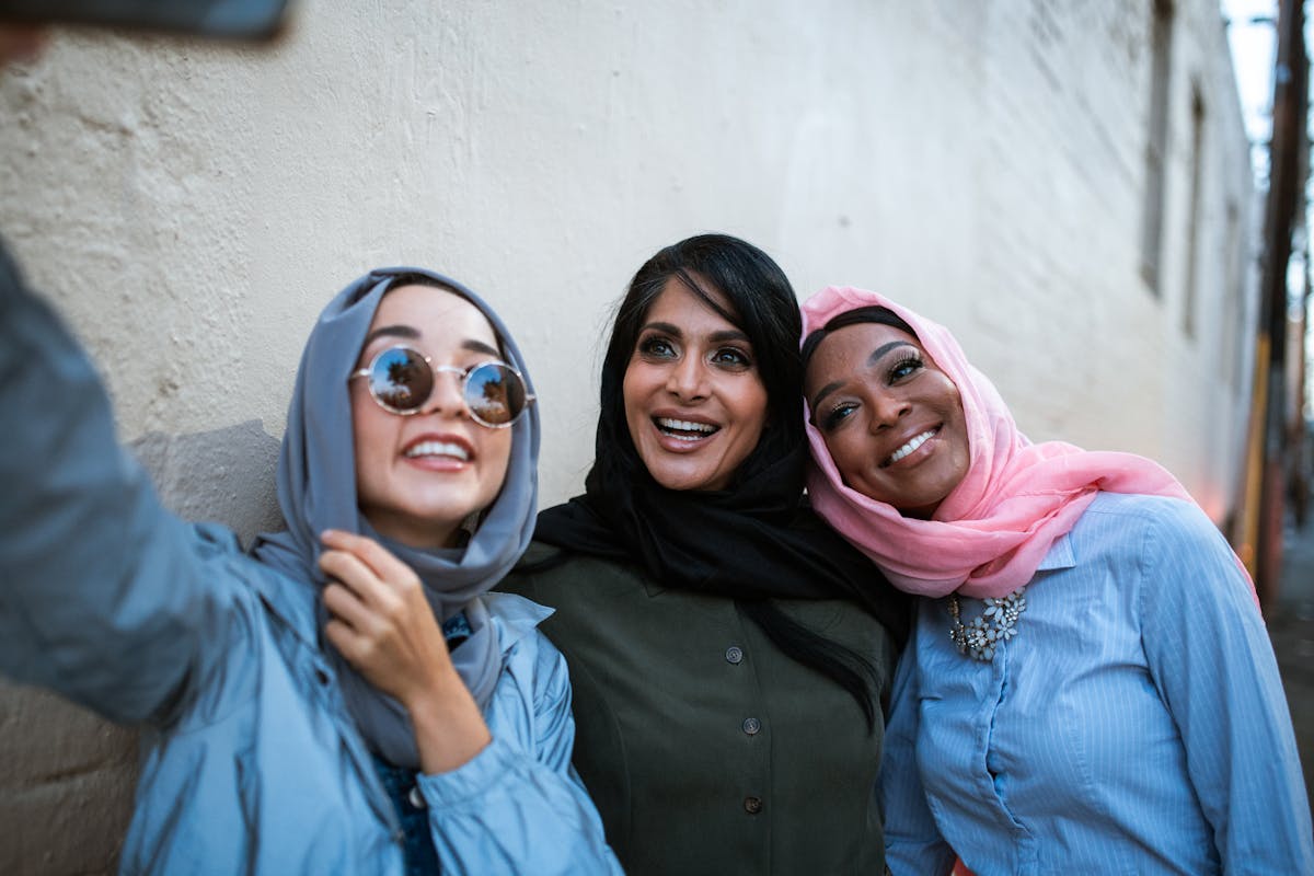 Women Wearing Headscarves Taking a Selfie