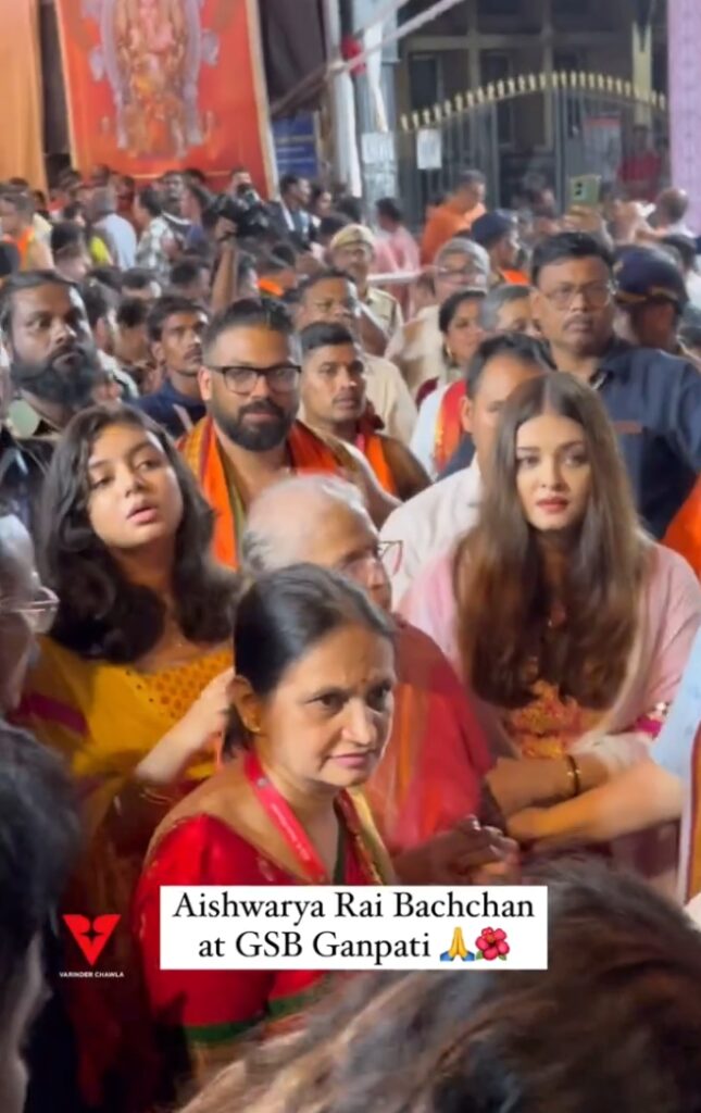 Bollywood actress and former Miss World Aishwarya Rai Bachchan, her mother Brindya Rai, and daughter Aaradhya Bachchan visited the GSB Cha Raja in Mumbai on Monday evening to offer prayers to Lord Ganesha. The trio was seen navigating the crowded streets with the assistance of heavy security. Aishwarya, dressed in a traditional pink salwar, was accompanied by her daughter Aaradhya, who wore a yellow kurta, and her mother Brindya, who was also in traditional attire. The family was seen engaging with the crowd and the security personnel as they made their way to the pandal. The visit was part of the ongoing Ganesh Chaturthi celebrations, a significant festival in Maharashtra, where devotees gather to seek blessings from Lord Ganesha. Aishwarya was seen guiding her mother through the crowd, ensuring their safety amidst the throngs of fans and devotees. Despite the heavy security, the location was bustling with activity, and many fans tried to catch a glimpse of the actress and her family. The paparazzi captured moments of Aishwarya interacting with a priest at the pandal and offering prayers. Aishwarya Rai Bachchan, who is known for her devotion and regular participation in religious festivities, made sure to take time out of her busy schedule to partake in the Ganesh Chaturthi celebrations. Her husband, actor Abhishek Bachchan, was notably absent from the event. The family was seen leaving the pandal after the darshan, with Aishwarya assisting her mother and daughter to their car. The visit was a testament to the actress’s dedication to her faith and her family’s traditions. Bollywood actress and former Miss World Aishwarya Rai Bachchan, her mother Brindya Rai, and daughter Aaradhya Bachchan visited the GSB Cha Raja in Mumbai on Monday evening to offer prayers to Lord Ganesha. The trio was seen navigating the crowded streets with the assistance of heavy security. Aishwarya, dressed in a traditional pink salwar, was accompanied by her daughter Aaradhya, who wore a yellow kurta, and her mother Brindya, who was also in traditional attire. The family was seen engaging with the crowd and the security personnel as they made their way to the pandal. The visit was part of the ongoing Ganesh Chaturthi celebrations, a significant festival in Maharashtra, where devotees gather to seek blessings from Lord Ganesha. Aishwarya was seen guiding her mother through the crowd, ensuring their safety amidst the throngs of fans and devotees. Despite the heavy security, the location was bustling with activity, and many fans tried to catch a glimpse of the actress and her family. The paparazzi captured moments of Aishwarya interacting with a priest at the pandal and offering prayers. Aishwarya Rai Bachchan, who is known for her devotion and regular participation in religious festivities, made sure to take time out of her busy schedule to partake in the Ganesh Chaturthi celebrations. Her husband, actor Abhishek Bachchan, was notably absent from the event. The family was seen leaving the pandal after the darshan, with Aishwarya assisting her mother and daughter to their car. The visit was a testament to the actress’s dedication to her faith and her family’s traditions. Aishwarya Rai takes daughter Aaradhya Bachchan, and her mother for Ganapati Darshan in Mumbai.