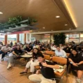 Executives and team members from Paywatch and Popeyes Philippines gathered to celebrate their new partnership, which aims to empower Popeyes employees