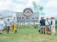 The team behind Bulacan Dragon Fruit Depot, led by Kevin Eliscupides (3rd from right), stands proudly in front of their farm's main entrance.