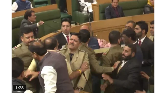 “Chaos in J&K Assembly: BJP Members Marshalled Out Over Special Status Resolution”