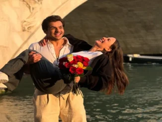 Ashish Chanchlani holding Elli AvrRam with bouquet in romantic Instagram photo