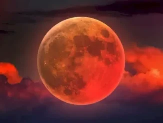 Chandra Grahan 2025 Blood Moon over Indian skyline