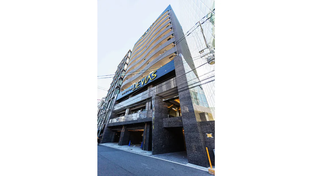 Osaka apartment building with minpaku signage
