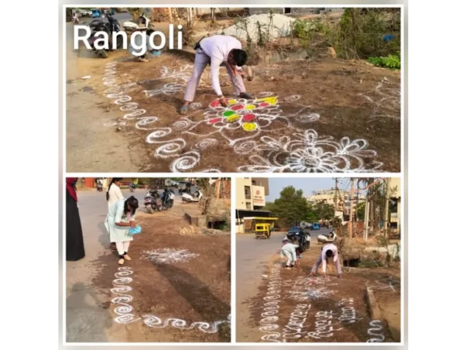 HDMC officials standing near a Rangoli-decorated clean spot in Hubballi.