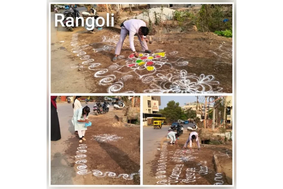 HDMC officials standing near a Rangoli-decorated clean spot in Hubballi.