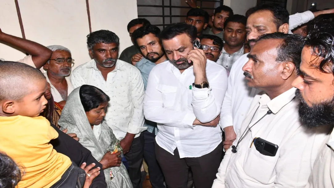 Minister Santosh Lad comforting families