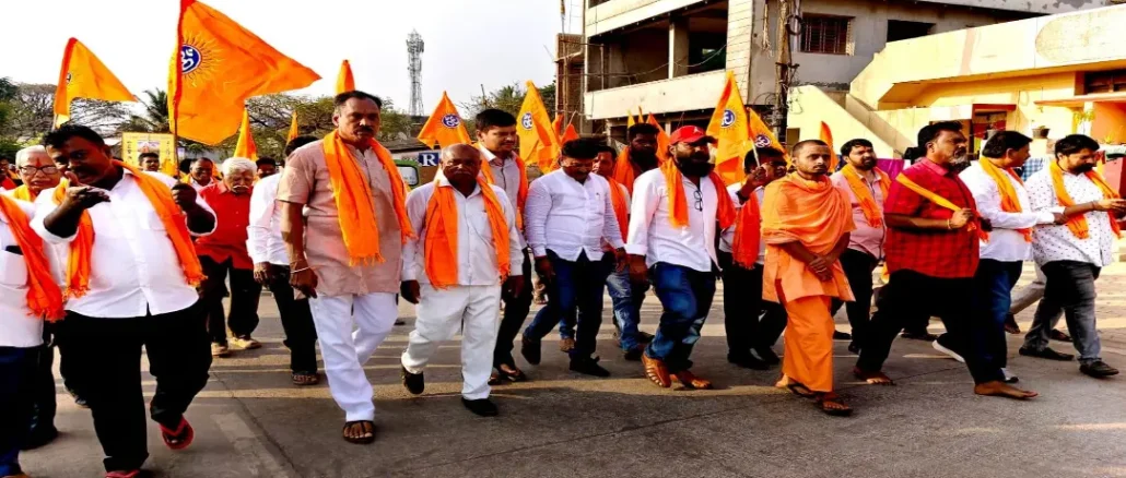 Saffron-clad devotees participating in the Hindu Sammelan procession at Shantinagar Bengeri Sante Maidan, Hubballi.
