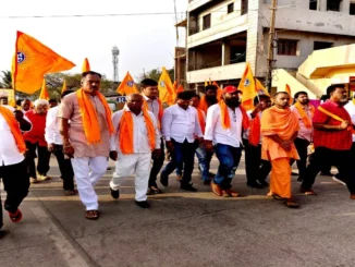 Saffron-clad devotees participating in the Hindu Sammelan procession at Shantinagar Bengeri Sante Maidan, Hubballi.