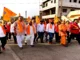 Saffron-clad devotees participating in the Hindu Sammelan procession at Shantinagar Bengeri Sante Maidan, Hubballi.