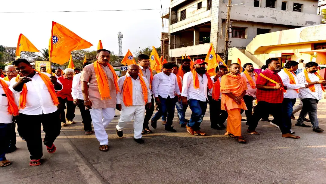 Saffron-clad devotees participating in the Hindu Sammelan procession at Shantinagar Bengeri Sante Maidan, Hubballi.