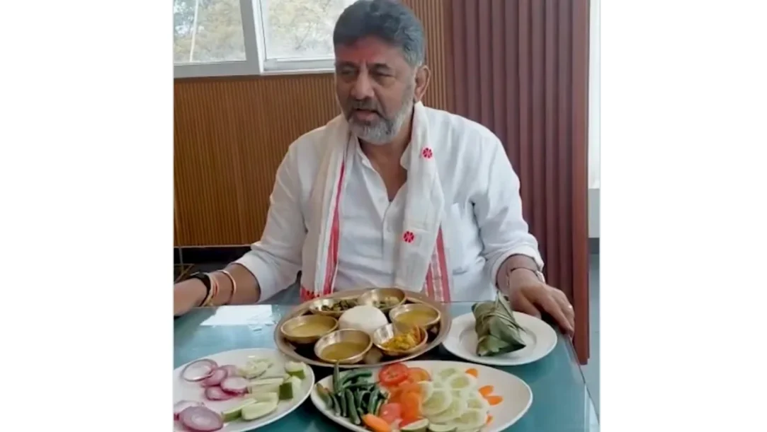 DK Shivakumar enjoying Assamese cuisine during campaign