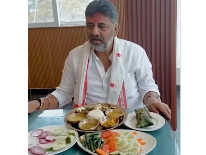 DK Shivakumar enjoying Assamese cuisine during campaign