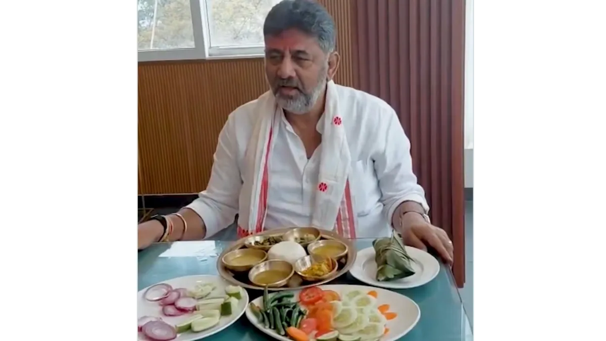 DK Shivakumar enjoying Assamese cuisine during campaign