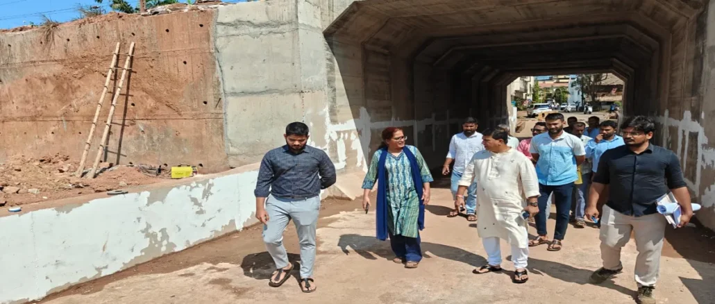 DRM Bela Meena and MLA Krishna Salkar reviewing the railway underbridge blueprints at the Vasco construction site.