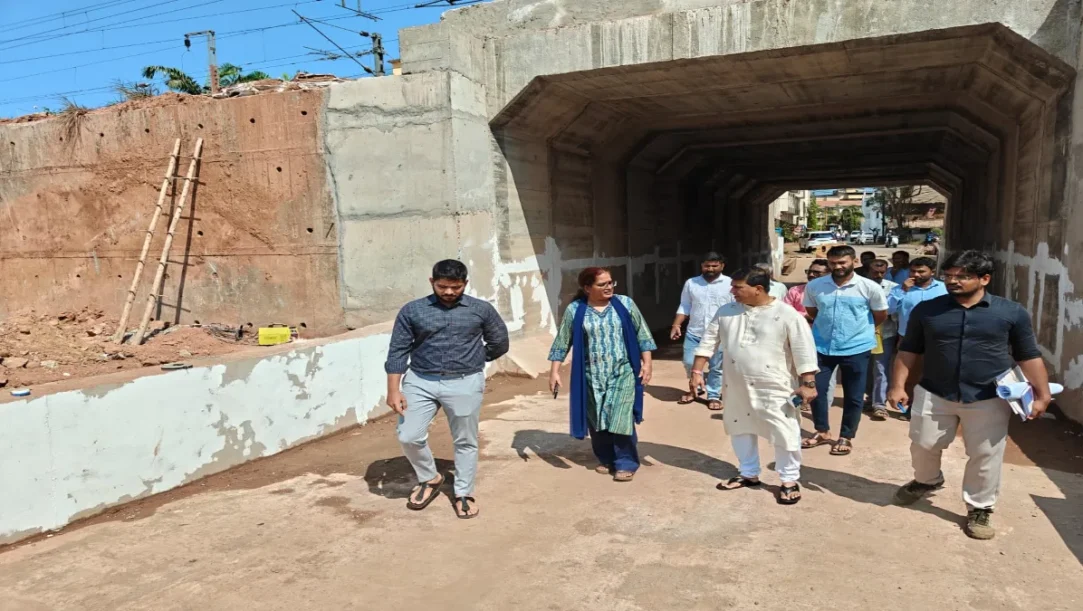 DRM Bela Meena and MLA Krishna Salkar reviewing the railway underbridge blueprints at the Vasco construction site.