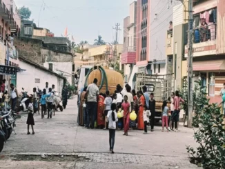 Water tanker and flooded road near Tarihal Bypass in Hubballi