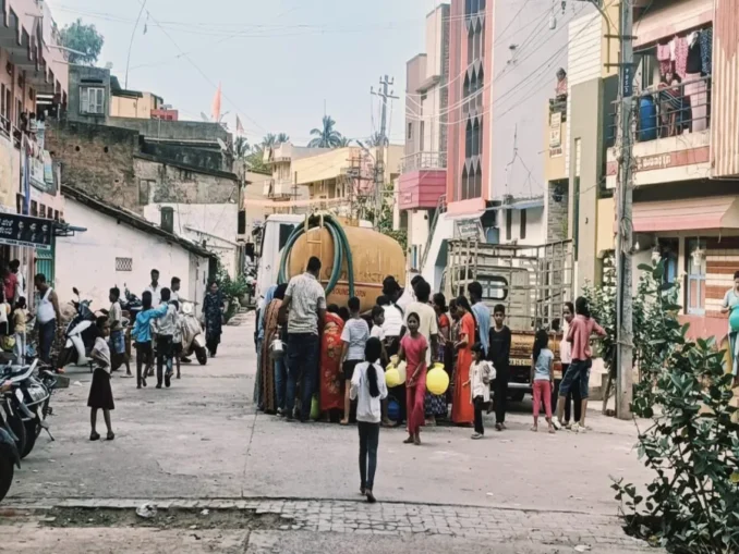 Water tanker and flooded road near Tarihal Bypass in Hubballi