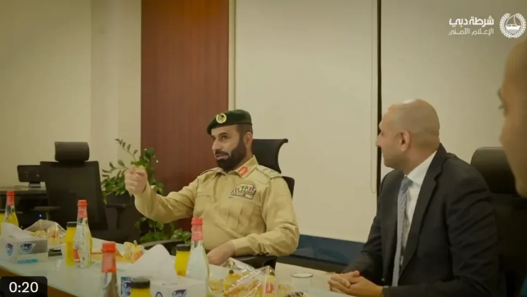 Dubai Police VOYAH FREE electric patrol vehicle parked in front of Dubai skyline.