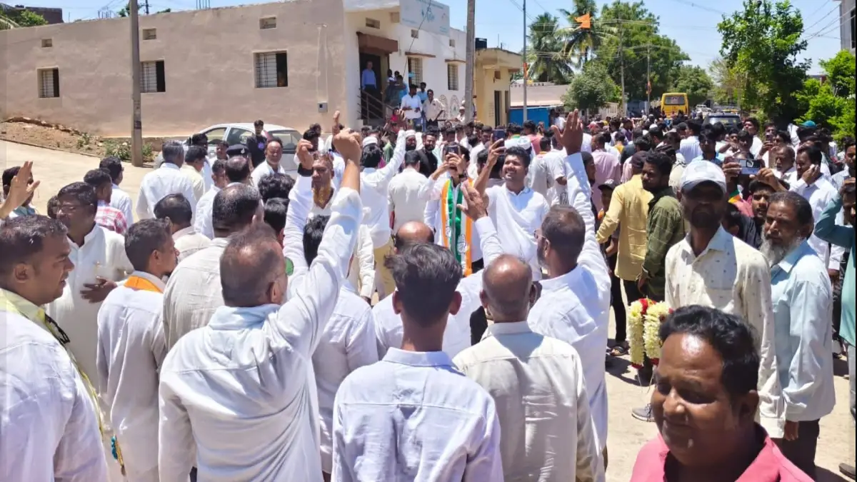 MLA Asif Sait leading a roadshow in Bagalkot with large crowds of supporters