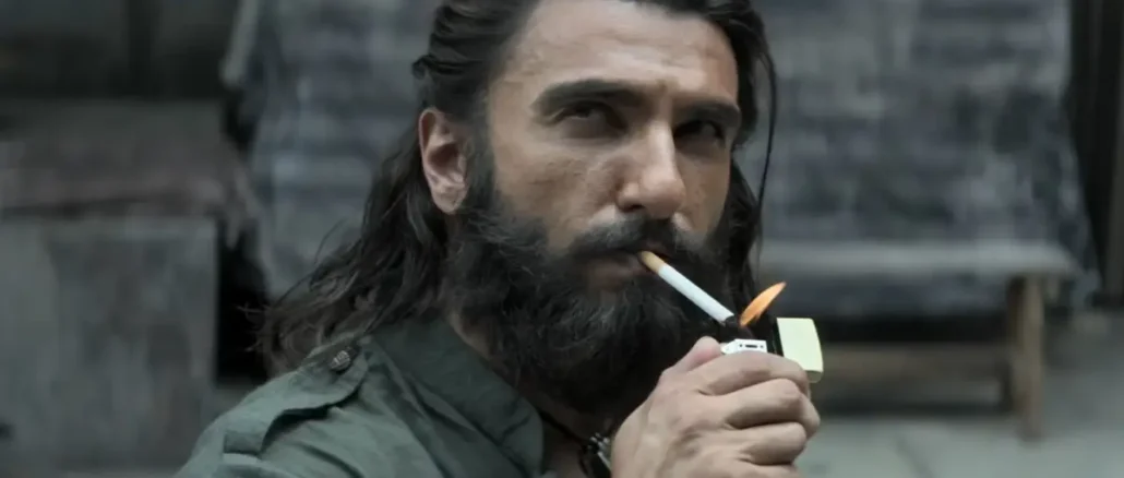 Dhurandhar 2 movie poster celebrating ₹900 crore India net and ₹1,490 crore worldwide gross.