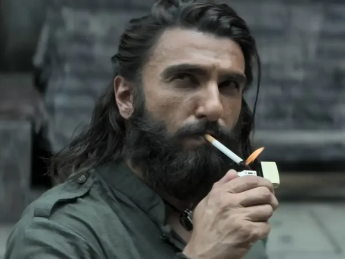 Dhurandhar 2 movie poster celebrating ₹900 crore India net and ₹1,490 crore worldwide gross.