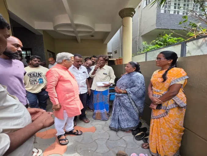 Govind Karjol interacting with farmers and local residents during a public grievance meeting in Chitradurga