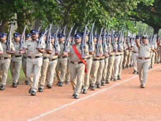 Police Commissioner N Shashi Kumar IPS receiving salute during weekly parade at Hubballi Old CAR grounds with DCP Shruti NS and DCP Ravish CR.
