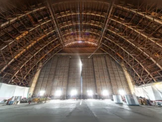 Labeled stack of reclaimed old-growth Douglas fir historic timber salvaged from Moffett Field Hangar 3