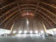 Labeled stack of reclaimed old-growth Douglas fir historic timber salvaged from Moffett Field Hangar 3