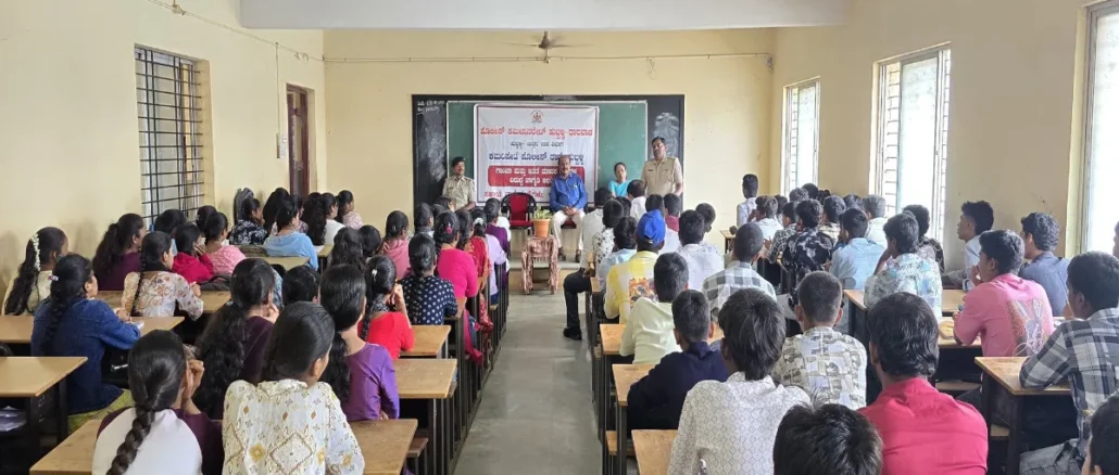 Police officers addressing college students in Hubballi during an interactive anti-drug awareness campaign session.