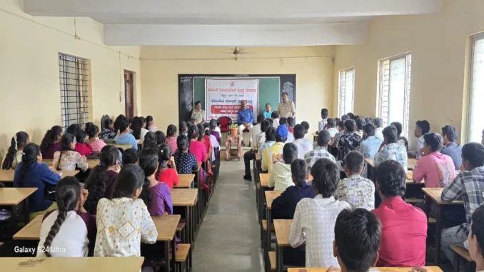 Police officers addressing college students in Hubballi during an interactive anti-drug awareness campaign session.
