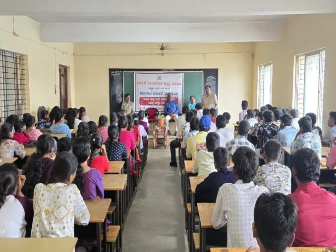 Police officers addressing college students in Hubballi during an interactive anti-drug awareness campaign session.