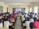 Police officers addressing college students in Hubballi during an interactive anti-drug awareness campaign session.