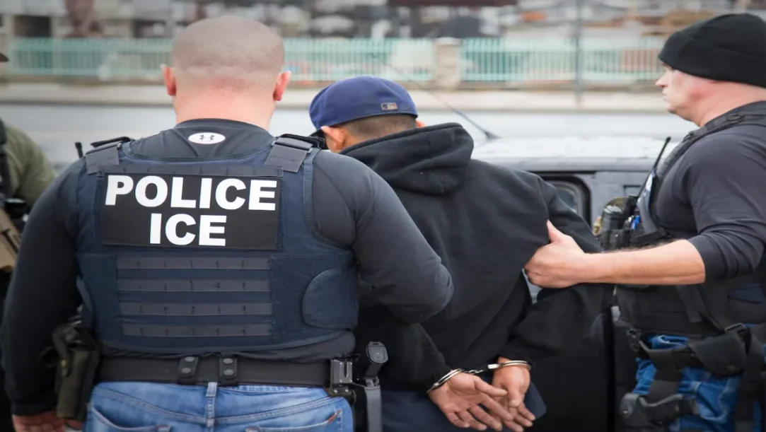 ICE agents checking passenger ID during airport security screening amid rising ICE airport arrests