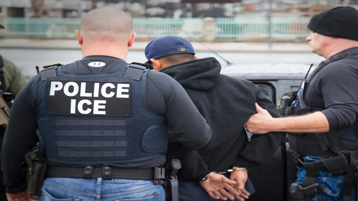 ICE agents checking passenger ID during airport security screening amid rising ICE airport arrests