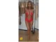 Bianca Censori fiery red cutout bodysuit Instagram photos August 2026